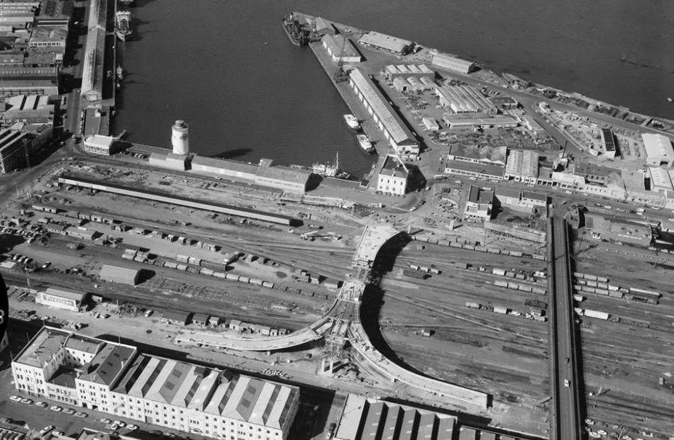 An aerial photograph from the mid-1970s shows the old vehicle bridge (right) during the...