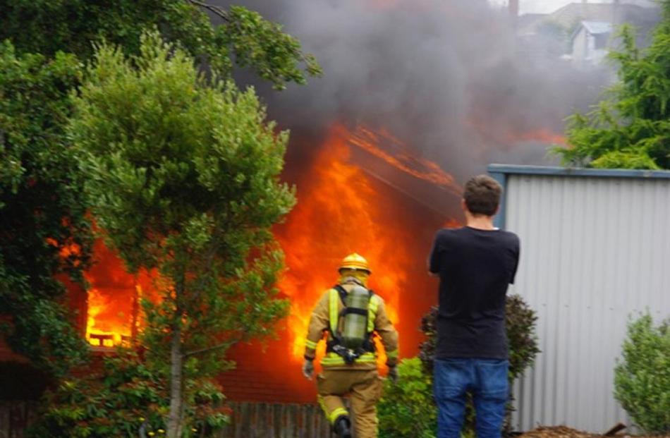 Firefighters attend a fire in Brockville yesterday. Photo: Kevin Goods