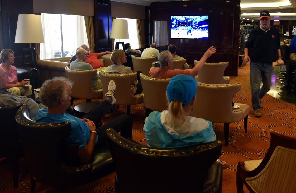 Guests watch an NFL playoff game  yesterday.