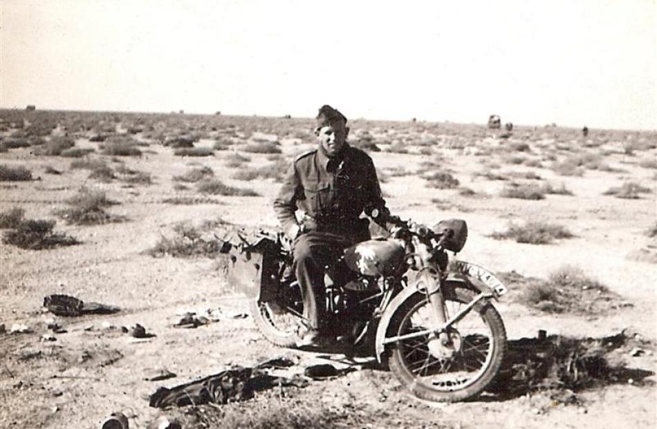 Peter Wildey on a German motorcycle in the Western Desert, North Africa. Photo courtesy of Peter...