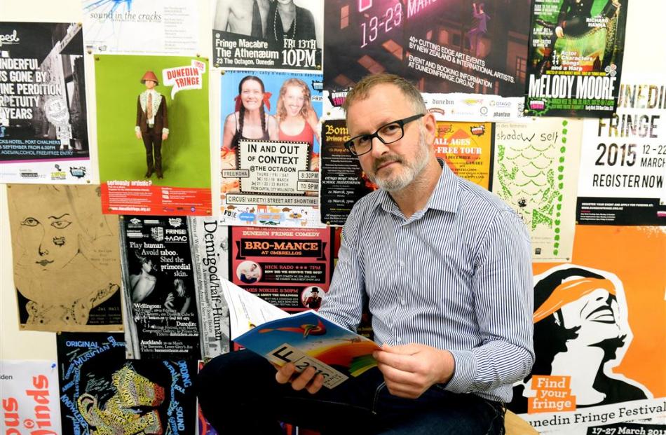 Dunedin Fringe Festival director Josh Thomas with this year’s programme. PHOTO: LINDA ROBERTSON