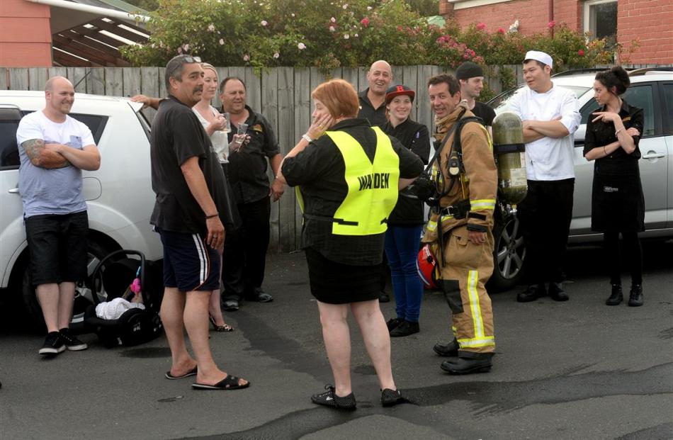 Senior Station Officer Pete Douglas talks to Robbies Bar and Bistro staff after the restaurant...