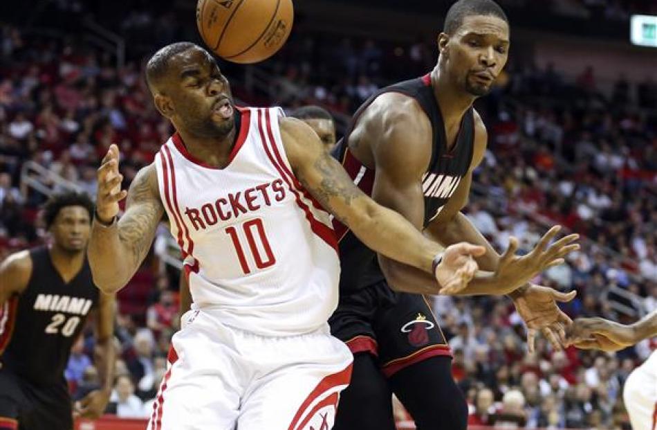 Houston Rockets forward Marcus Thornton has the ball bounce off his head as Miami Heat forward...