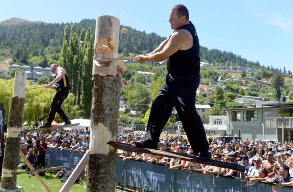 Kyle Lemon (New Zealand) leads David McIntosh (right) in the woodchopping tree-felling event.