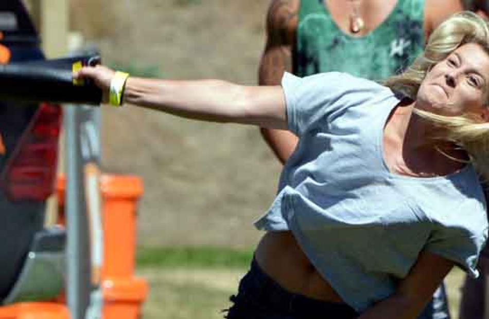 Sarah Reid, of Feilding, competes in the gumboot throw.