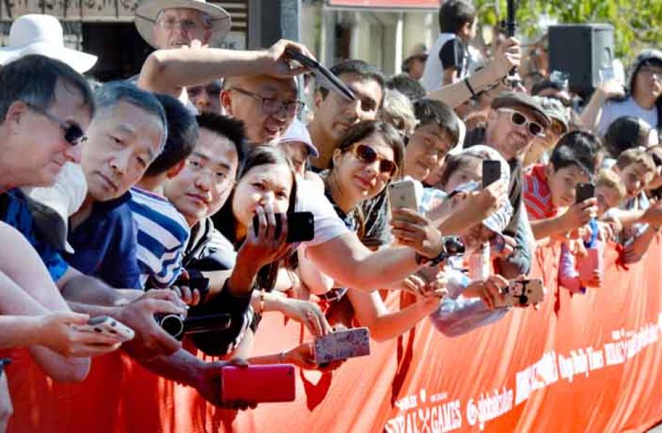 Many international visitors to Queenstown were in the crowd watching the ‘‘Running of the Wools’’.