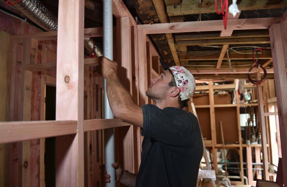 Plumber Matt Barron adjusts  piping in the new toilet block at the Globe Theatre. PHOTO: GREGOR...