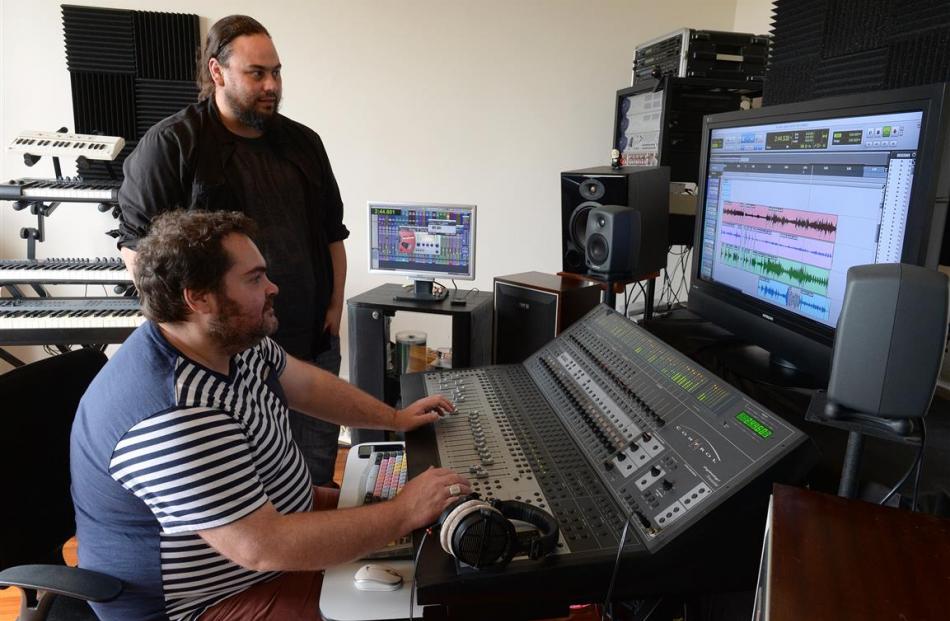 Paul Sammes (seated) works on a song with Dunedin musician Jacob Ambrose, aka Ronnie Stash. Photo...