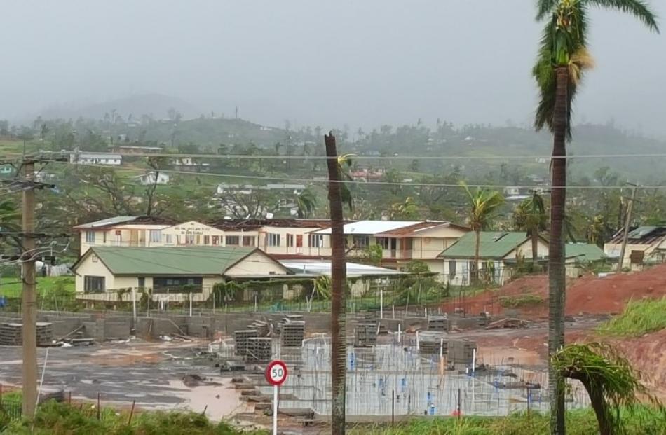 Damage to buildings and trees can be seen in the town of Ba on Viti Levu island.