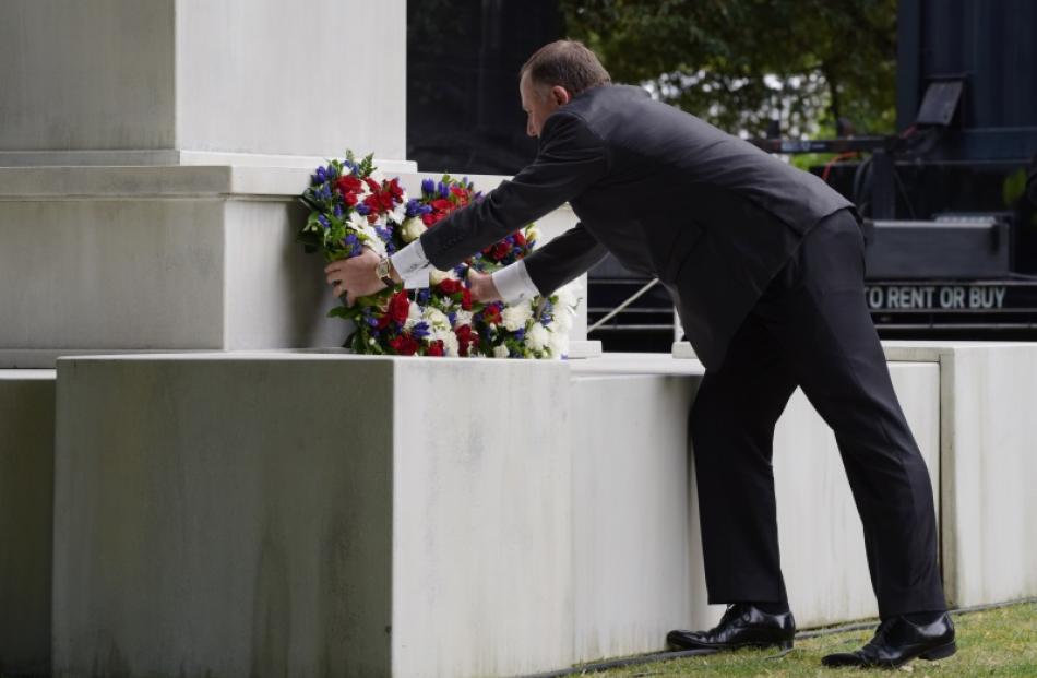 Prime Minister John Key places a wreath during the service. Photo: Getty Images
