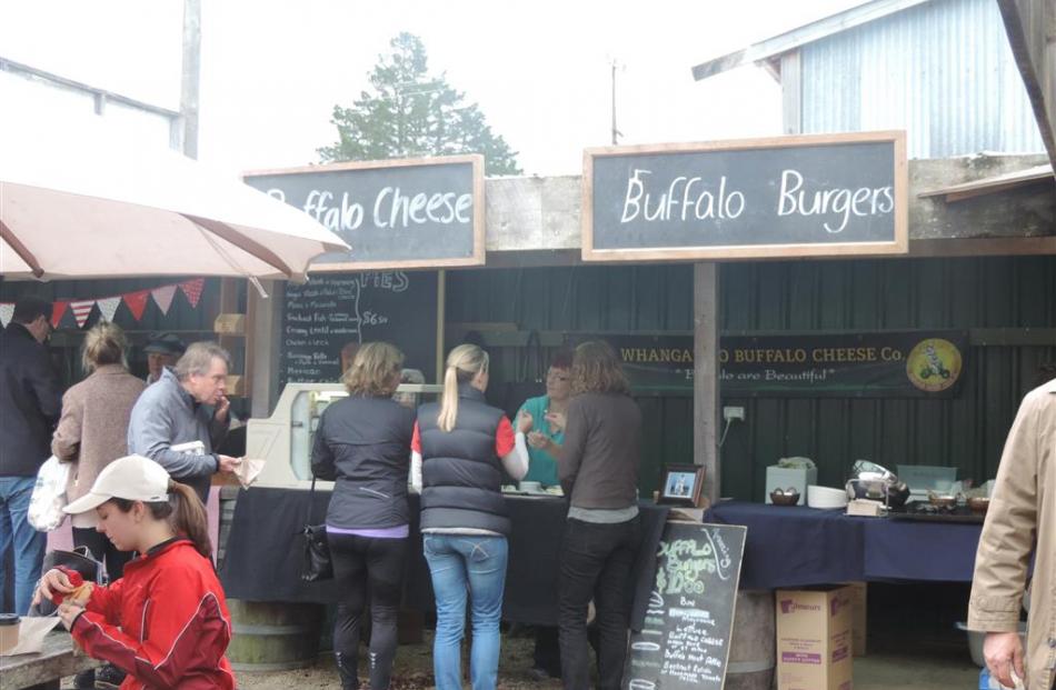 Buffalo cheese and burgers for sale at Matakana market.