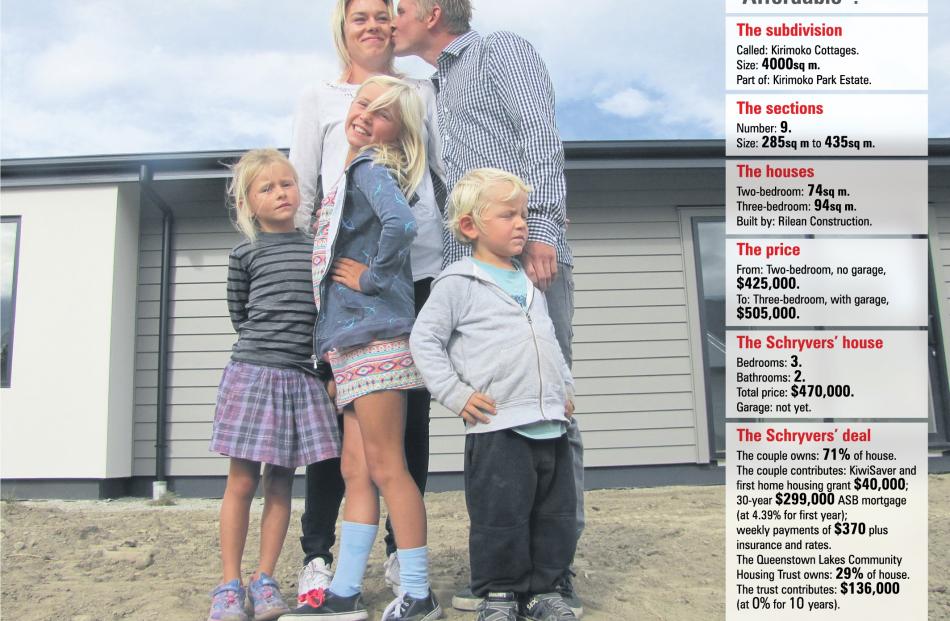 A family ready and waiting to move into their Kirimoko cottage in Wanaka (front, from left) Paige...