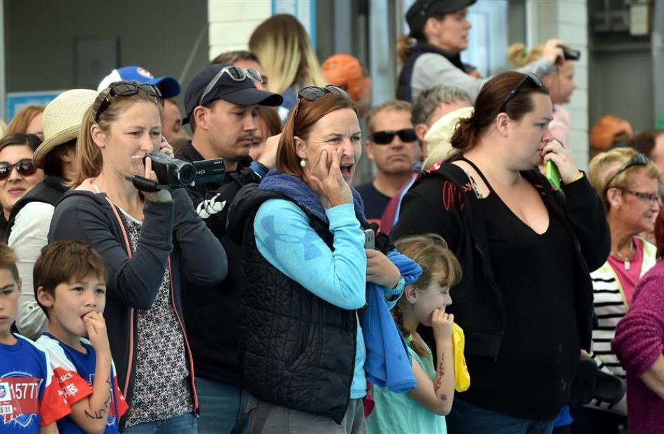 Parents cheer on their children competing in the swimming leg at the TRYathlon.