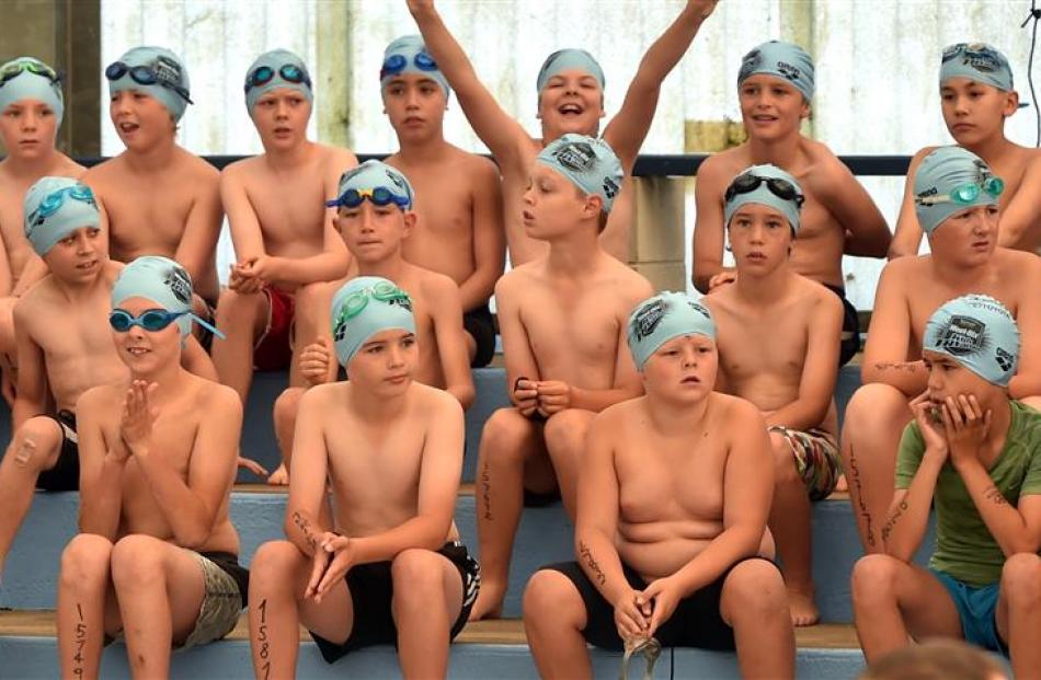 Ten-year-old boys wait to start the swimming leg at the Weet-Bix Kids TRYathlon at Memorial Park,...