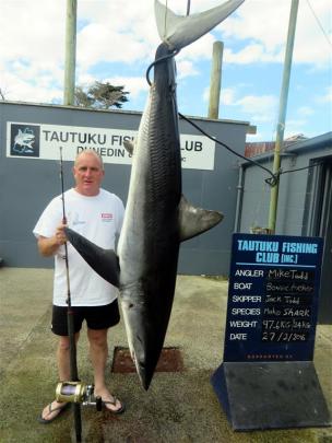 Michael Todd, of Dunedin, with his 97.6kg mako shark, which helped the Tautuku Fishing Club win...