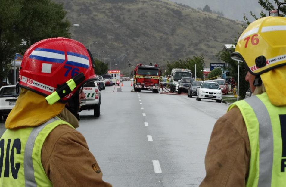 Firefighters work on Glenda Dr in the Frankton industrial area yesterday following a chemical...