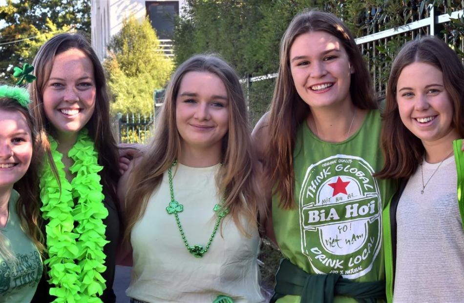 Showing their colours in Castle St are law and science students (from left) Tiffany Brown (19),...