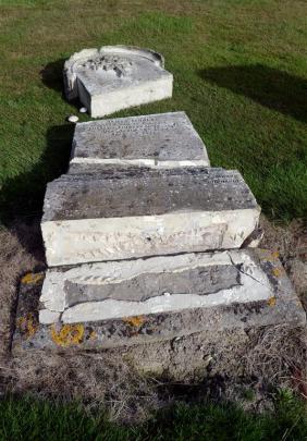 Other broken headstones in the cemetery.