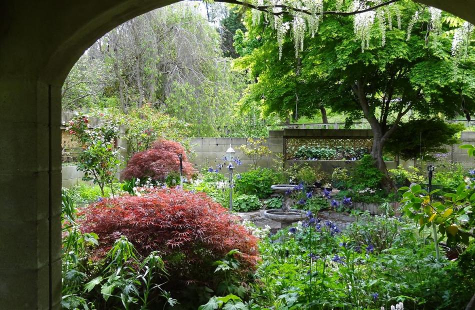 he courtyard at Murray and Noeleen Radka’s Springvale garden, seen here in the spring. The...