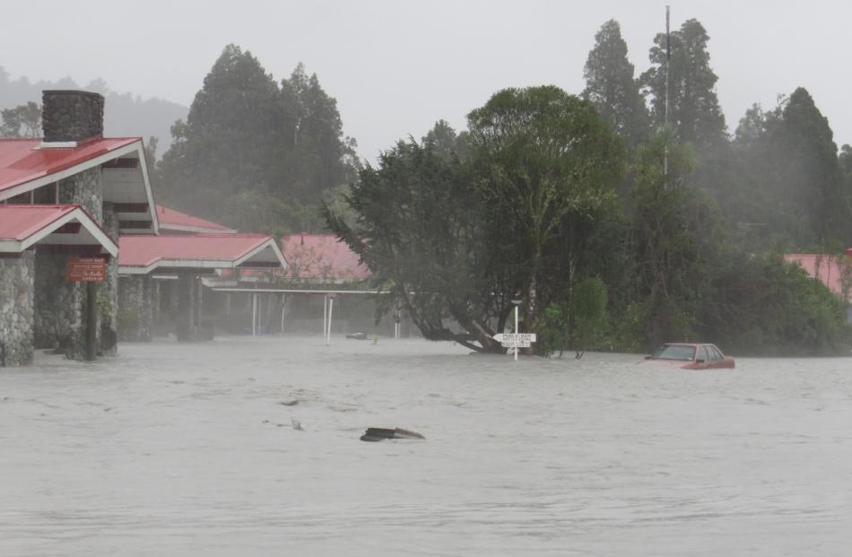 The river of raging water has forced evacuations and damaged buildings. Photo from the Greymouth...