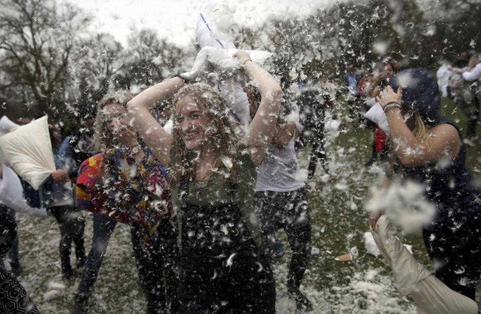 Participants take part in International Pillow Fight Day in Kennington Park in south London....