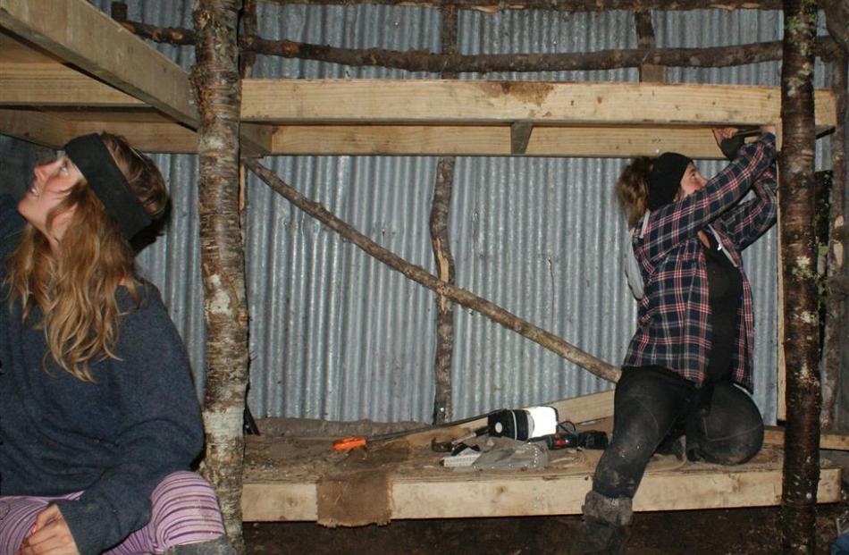 University of Otago senior physical education students Grace Olliver (left) and Ella Haig help to...