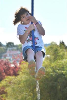 Amy Smith (8), of Brighton, tries out the flying fox.