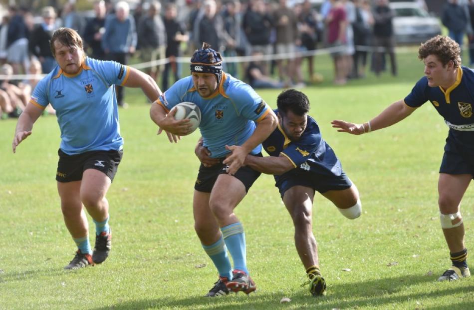 Action from today's match between Dunedin and University. Photo: Peter McIntosh