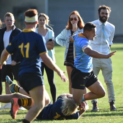 Action from today's match between Dunedin and University. Photo: Peter McIntosh