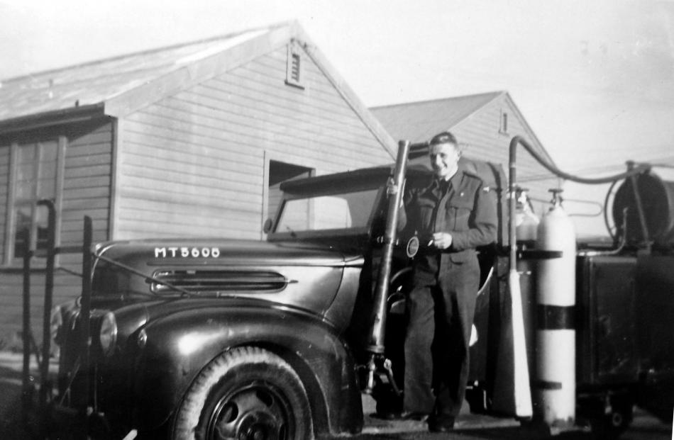 Robert Angell with the 1940s Ford ‘‘Jailbar’’ fire engine during World War 2, when it was used as...