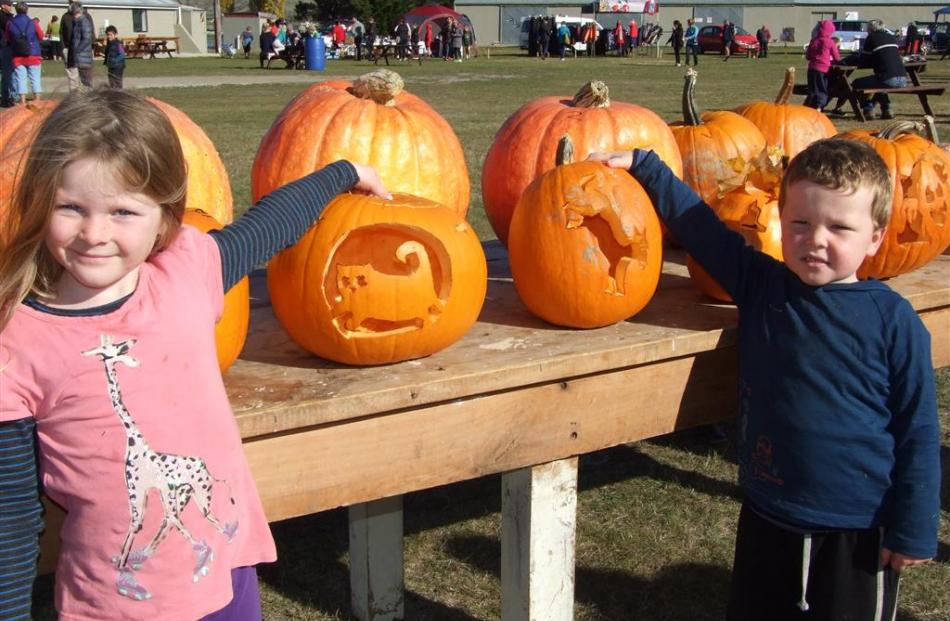 Olivia (6) and Jacob (4) McDonald, of Roxburgh, with their carved pumpkins. Olivia said it took ‘...