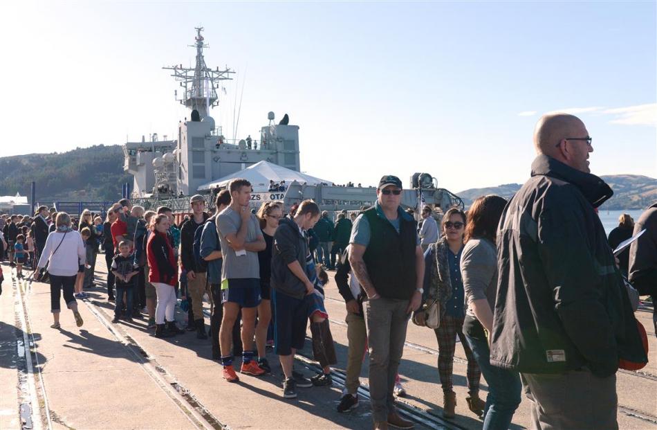 Hundreds of people queue to board Royal New Zealand Navy offshore patrol vessel HMNZS Otago.