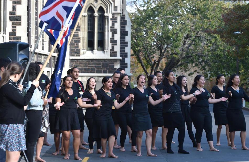 The Te Roopu Maori kapa haka group performs outside the University of Otago clocktower for the...