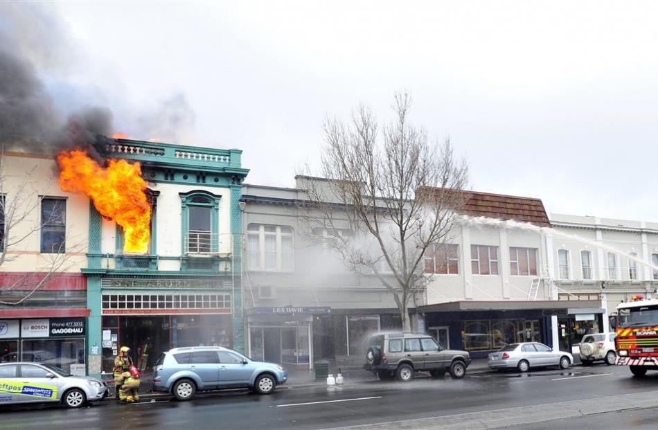 The building burns in 2011. Photo by Craig Baxter.
