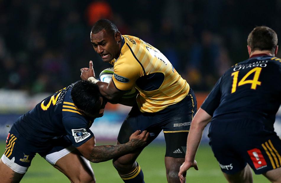 Malakai Fekitoa tackles Tevita Kuridrani for the Highlanders in their win over the Brumbies....