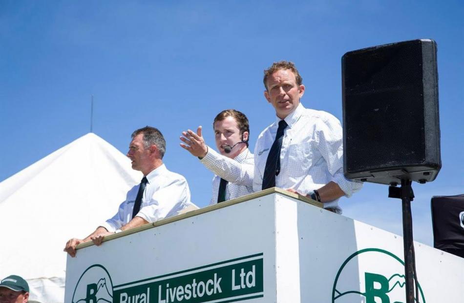 Madison Taylor (centre) uses his auctioneering abilities. Photos supplied.