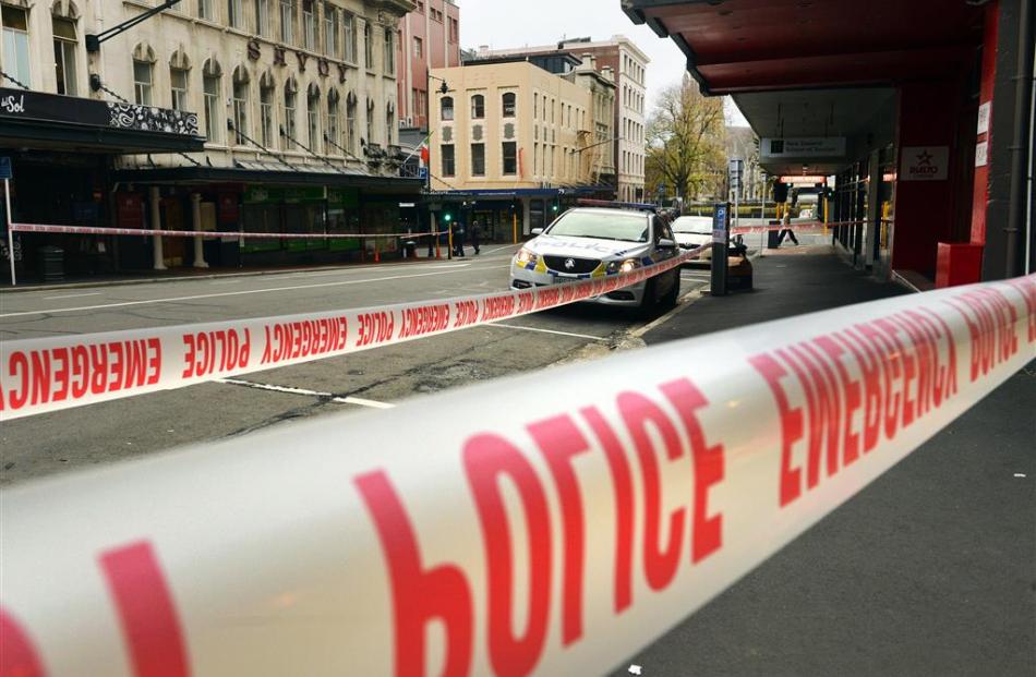 Police investigate a stabbing in central Dunedin yesterday. Photo: Stephen Jaquiery