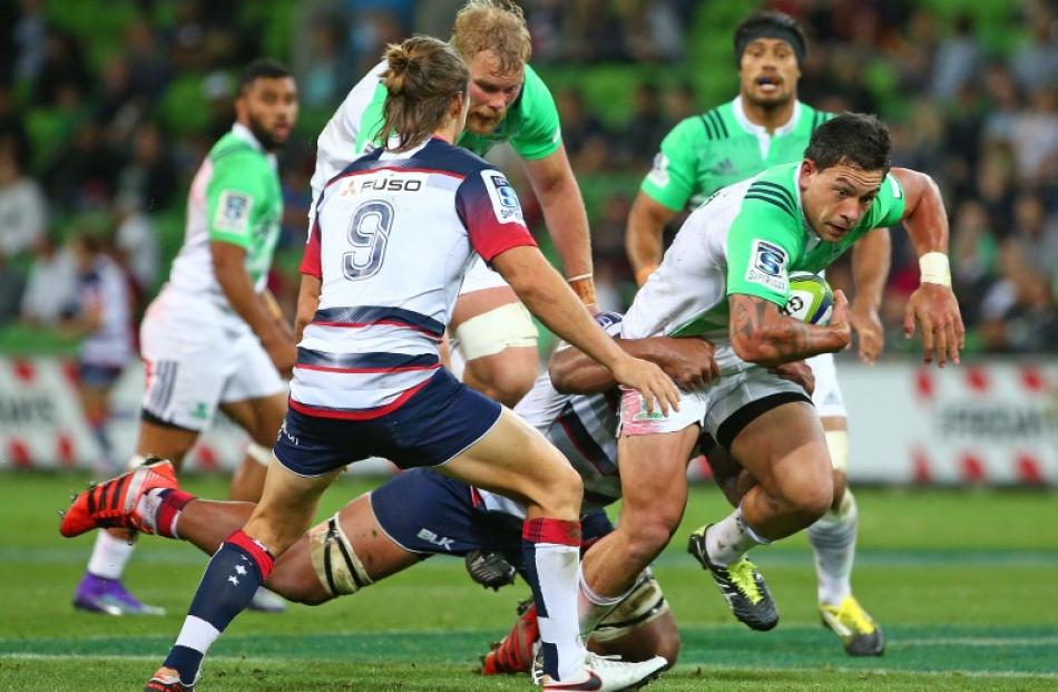 Rob Thompson (with ball) was a key player in the Highlanders' win over the Rebels which saw them...