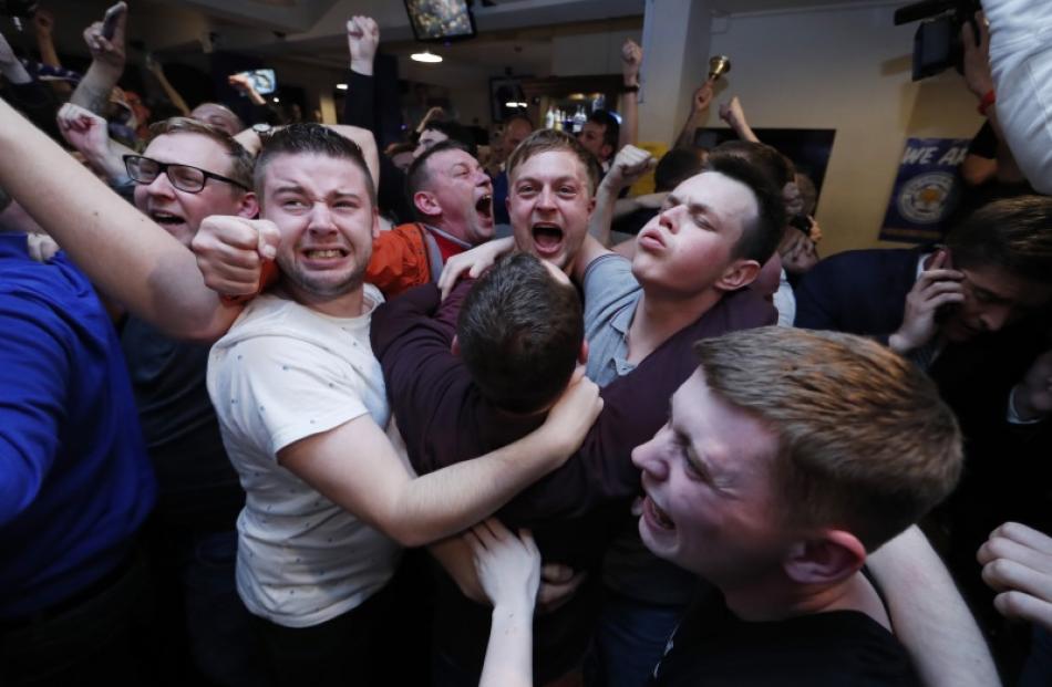 Leicester fans celebrate after their team won the Premier League title. Photo: Reuters