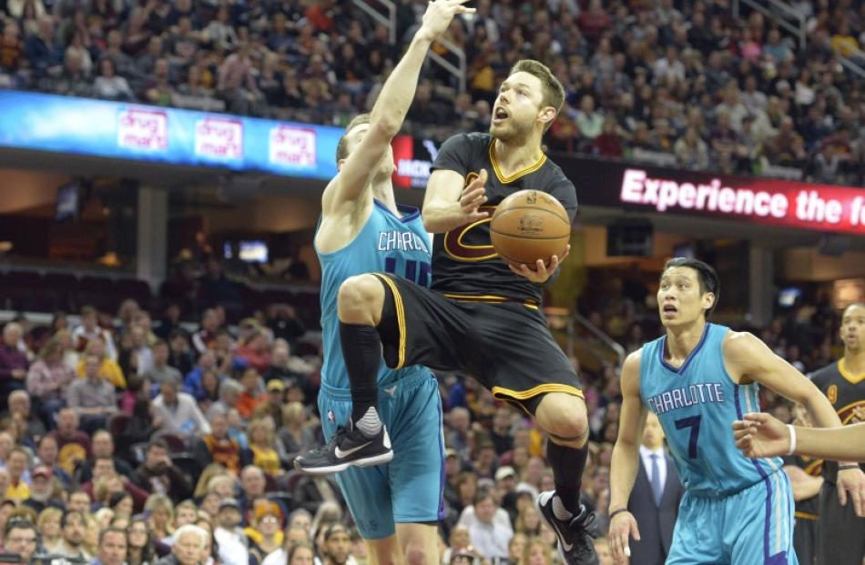 Australian NBA player Matthew Dellavedova takes the ball to the hoop for the Cleveland Cavaliers...