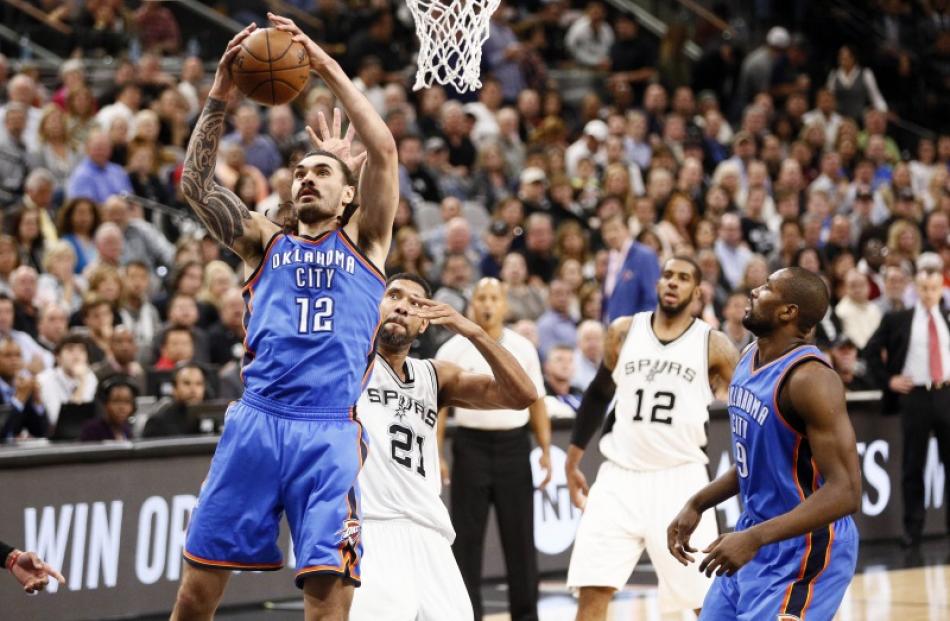 Steven Adams pulls down a rebound for the Oklahoma City Thunder. Photo: Reuters