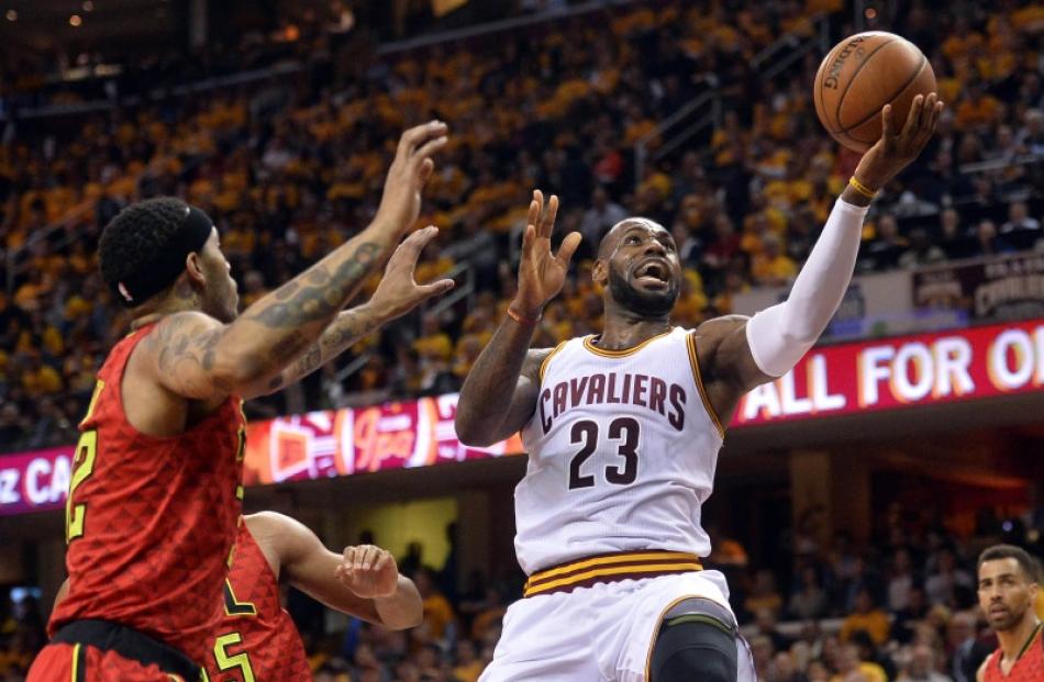 LeBron James goes to hoop against the Hawks. Photo: Reuters