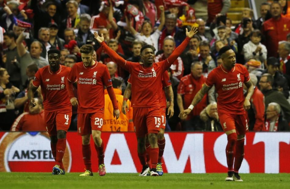 Daniel Sturridge celebrates with team mates after scoring Liverpool's second goal. Photo: Reuters