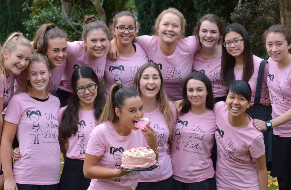 Tahlia Green (17) tucks into a slice of pink pavlova. (Back from left) Olivia Anderson (17),...