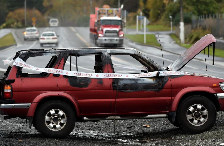 A burnt out vehicle near Sawyers Bay is the subject of an investigation by Dunedin police. PHOTO:...