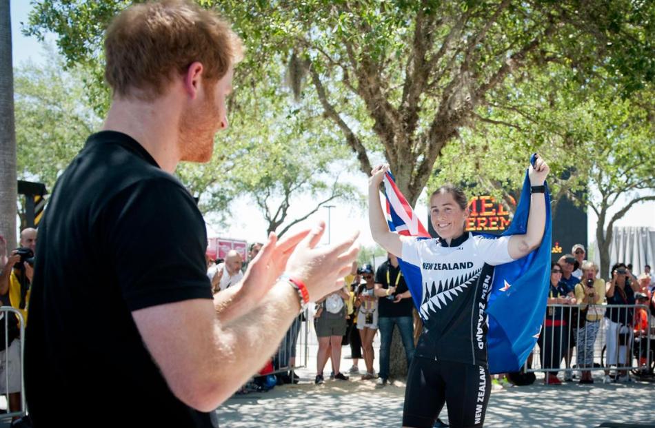 Chief Petty Officer Amy Baynes, originally of Gore, is applauded by Prince Harry after winning...