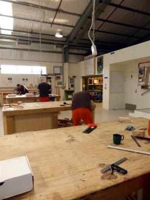 Prisoners  work on the boxes.