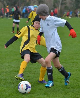 Luke Pullar (right, 9), of Roslyn-Wakari Panthers, takes the attack to Hugh Jack (10), of Grants...