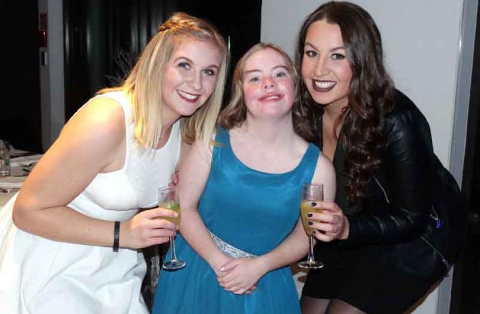 Esther Swan (19) enjoys the formal with teaching staff Dom Brosche (left) and Kerry Thompson ...