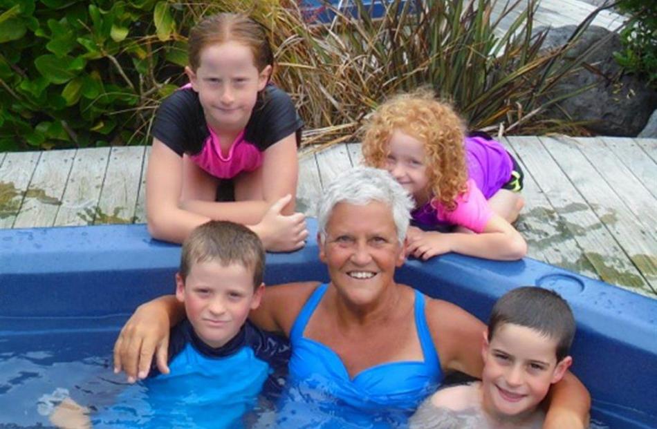 Natalie Yule Yeoman in a Kaikoura hot tub with grandchildren.